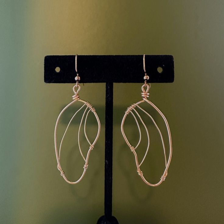 Handmade, light gold wire earrings! Inspired by butterfly wings, these are a perfect gift or pair for personal use. Made to order-- message for special requests (I can make these in silver as well!) Gold Wire Dangle Earrings, Handmade Metal Butterfly Earrings, Handmade Butterfly Metal Earrings, Nickel-free Copper Wire Earrings As Gift, Nickel Free Copper Wire Earrings As A Gift, Handmade Gold Wing-shaped Earrings, Copper Wire Wrap Drop Earrings As Gift, Wire Wrapped Rose Gold Earrings For Gift, Gold Wire-wrapped Earrings