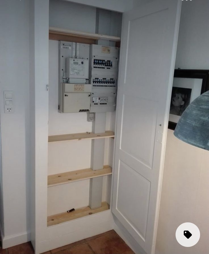 an electrical panel in the corner of a room