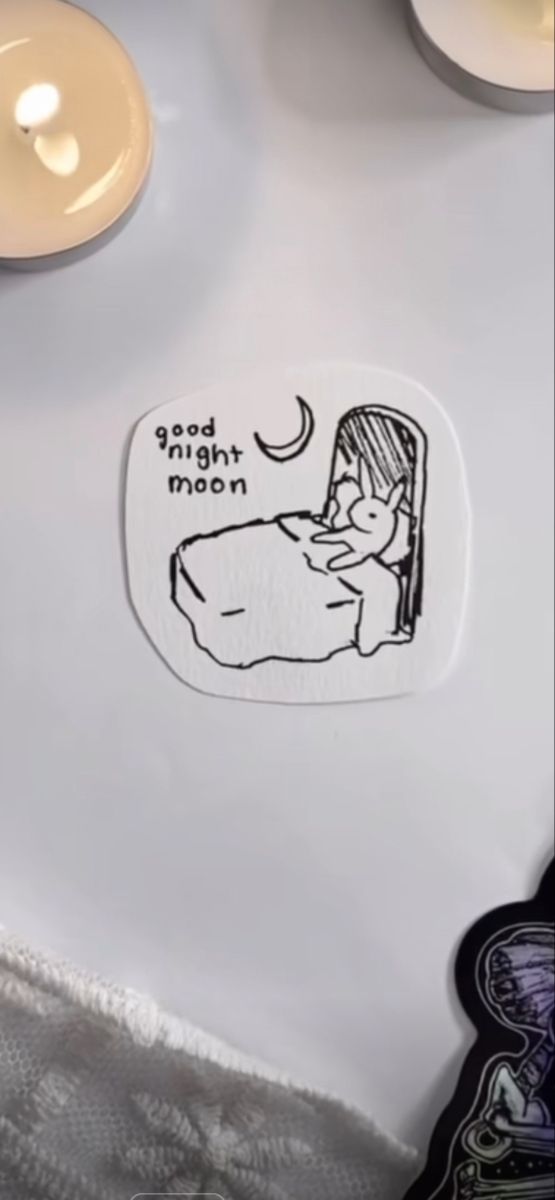 the sticker on the table has an image of a woman sleeping in her bed