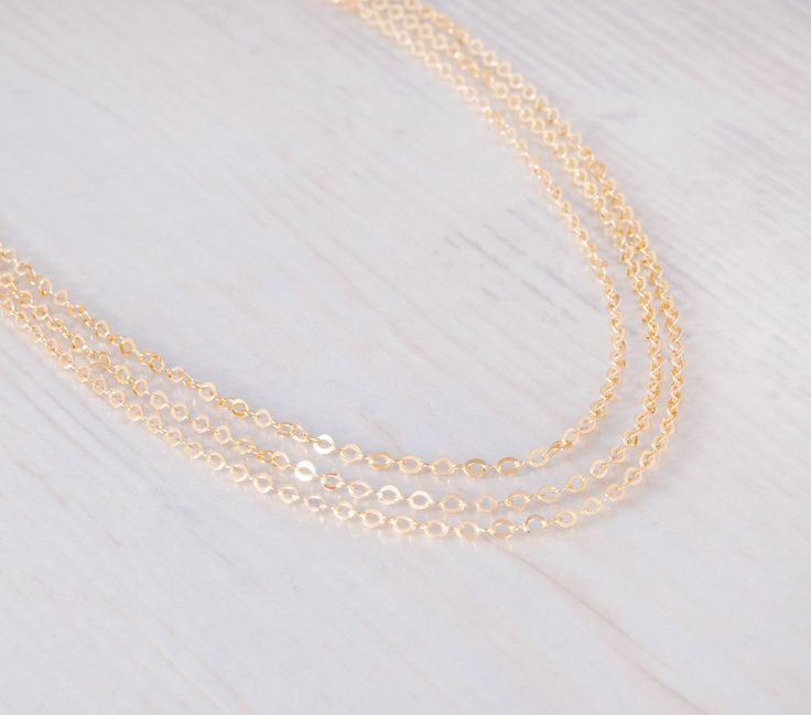 "~ Simplicity Choker~ Dainty choker chain, you can choose 1, 2, 3 layers as shown; all layers are attached to one clasp and can't be separated. This choker necklace can be layered with your other necklace collection and also be worn alone. Comes with 3\" extension chain ▸▸ Material ◂◂ All components are 14K gold filled. ▸▸ Layers◂◂ Comes in 1 / 2 / 3 layers, choose the number of layers you want. ▸▸ Necklace Length ◂◂ 13\" + 3\" extending chain. Leave a note at checkout if you want a different le Yellow Gold Chain Choker As Gift, Dainty Layered Cable Chain Necklace For Gifts, Delicate Chain Link Choker, Delicate Chain Link Choker Gift, Delicate Chain Link Choker For Gift, Gift Delicate Chain Link Choker, Delicate Layered Chain Necklace As Gift, Delicate Layered Chain Necklace Gift, Delicate Chain Layered Link Necklace As Gift