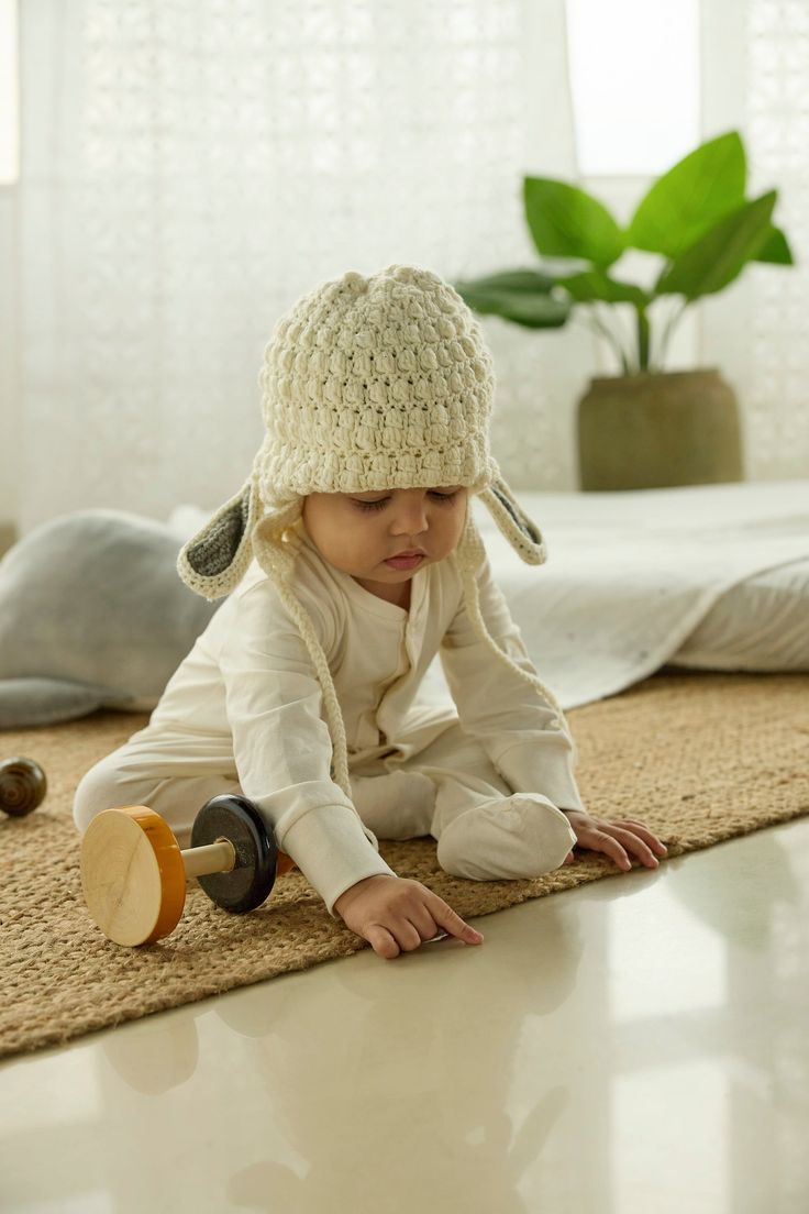 Introducing our Sheepy hand crocheted sheep cap in Merino wool, featuring an adorable sheep design. This charming cap combines playful design with superior comfort, making it a delightful addition to your little one's wardrobe. Merino Wool Construction: Made from the finest merino wool, our Sheepy cap offers exceptional warmth and softness, ensuring your baby's head stays comfortable and cozy all day long. Hand Crocheted Excellence: Each cap is meticulously hand crocheted by skilled artisans, re Crocheted Sheep, Sheep Design, Crochet Sheep, Merino Sheep, Cozy Accessories, Crochet Cap, Wool Caps, Sustainable Products, Baby Head