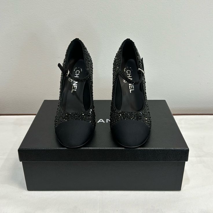 These Are Chanel Heels In The Color Black. It Has Diamonds All Over It With White Pearls On The Back. Comes In The Size 38, Has Its Own Dust Bag . Brand New In Great Condition Evening Dance Shoes With 4-inch Heel, Elegant Black Dance Shoes, Evening Court Shoes With Heel Tab And Round Toe, Luxury Ankle Strap Court Shoes For Evening, Elegant Pointed Toe Dance Shoes With Heel Strap, Black Almond Toe Dance Shoes For Evening, Elegant Black Dance Shoes For Evening, Evening Closed Toe Heels With Contrasting Heel Counter, Evening Heels With Heel Tab And Almond Toe