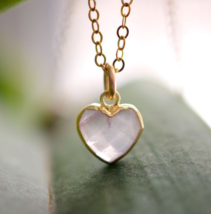 Looking for a unique accessory for some self love, or love for that special someone? Crafted from 14k gold filled and natural Rose Quartz, this pendant is the perfect, sparkling way to show anyone how much you care. Rose Quartz is a stone of love. It is believed to restore trust & harmony in relationships and encourage unconditional love. It purifies the heart and promotes self love, inner healing, and friendship. It is an alternate birthstone for January, as well as the spiritual birthstone for Handmade Rose Gold Heart Pendant Jewelry, Delicate Jewelry With Heart Charm For Mom, Delicate Heart Charm Jewelry For Mom, Delicate Heart Charm Jewelry As Gift For Mom, Delicate Jewelry With Heart Charm For Mom's Gift, Delicate Heart Charm Jewelry Gift For Mom, Rose Gold Heart Charm Jewelry As Gift, Rose Gold Heart Necklace With Birthstone For Mom, Rose Gold Heart Charm Jewelry Gift