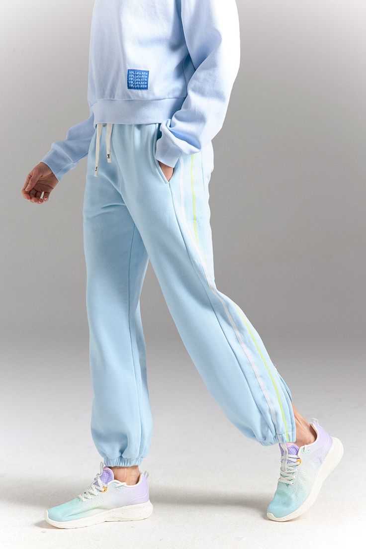 Once you’re in these, you’ll never, ever want to take them off. The Tearaway Zip Pants is made from soft cotton for an elevated look for to & from or post-practice recovery. Seriously snuggly & breathable, with front patch pockets & a drawstring waistband — pairs perfectly with any look. Sporty Full-length Bottoms For Lounging, Blue Relaxed Fit Sweatpants With Ribbed Waistband, Blue Relaxed Fit Joggers With Ribbed Waistband, Blue Joggers With Ribbed Waistband And Relaxed Fit, Blue Relaxed Fit Pants With Ribbed Waistband, Cotton Workout Sweatpants With Side Pockets, Blue Athleisure Sweats With Ribbed Waistband, Blue Sweats With Ribbed Waistband For Loungewear, Comfortable Blue Joggers With Ribbed Waistband