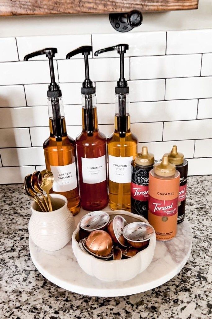 several different types of soaps and lotions on a white plate in front of a marble counter top