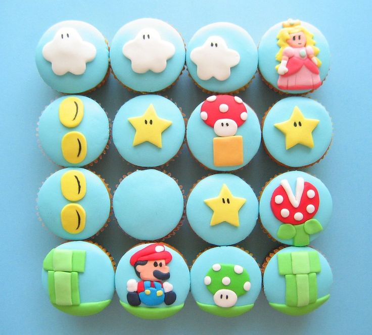 some cupcakes are decorated with mario bros characters