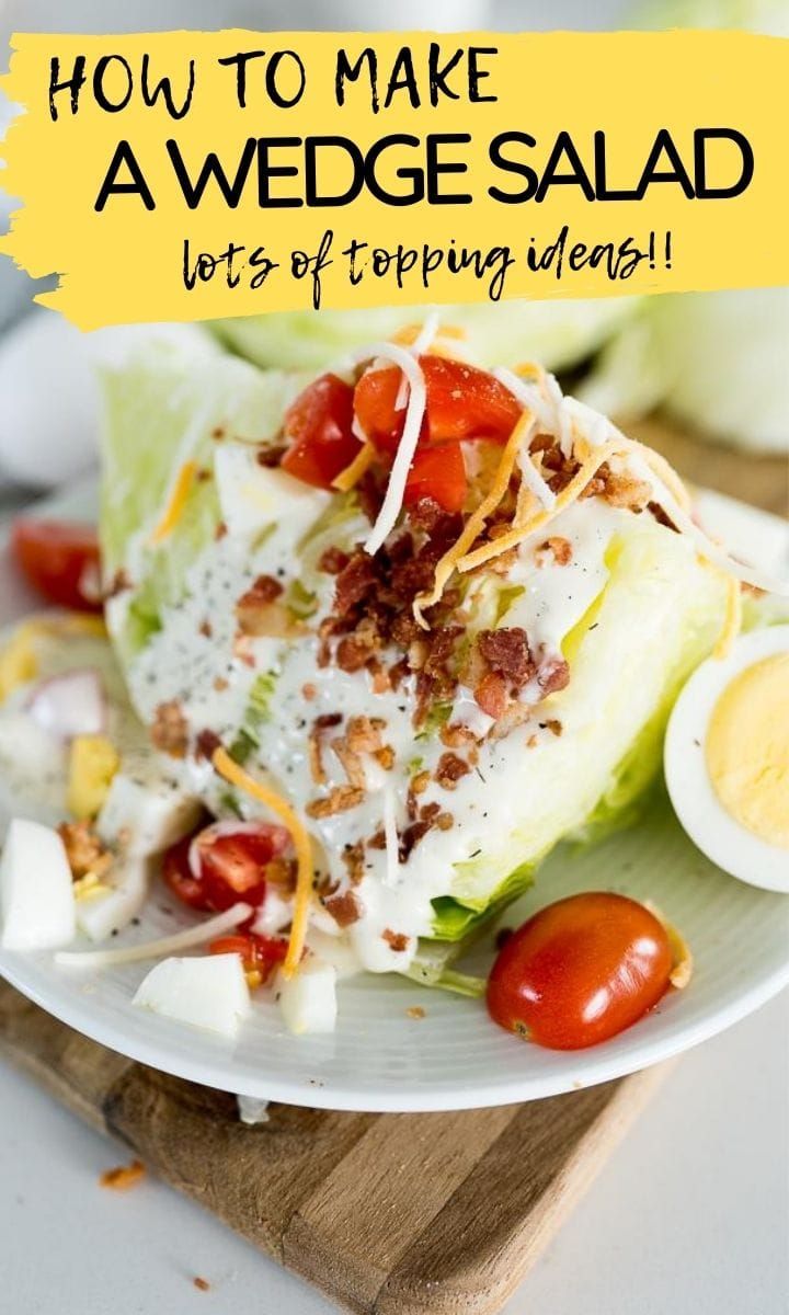 lettuce salad on a white plate with tomatoes and hard boiled eggs in the background