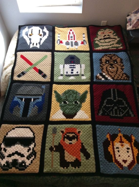 a crocheted blanket with star wars pictures on it