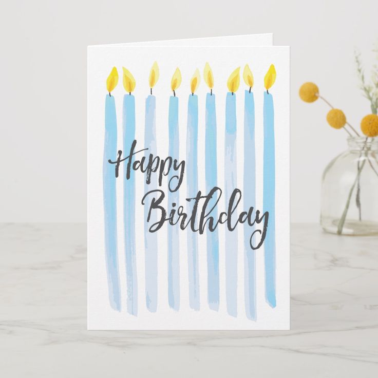 a birthday card with blue candles on it