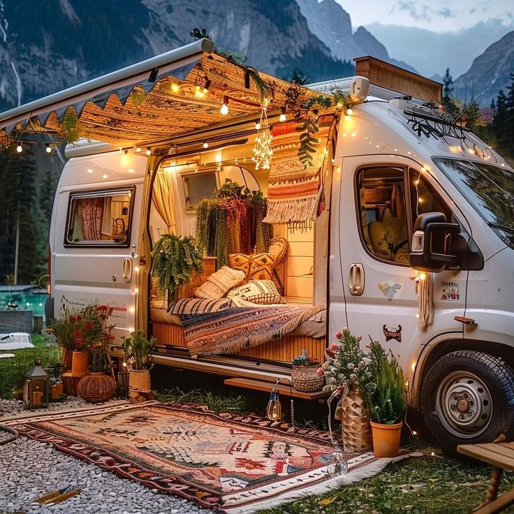 a camper van is decorated with plants and lights