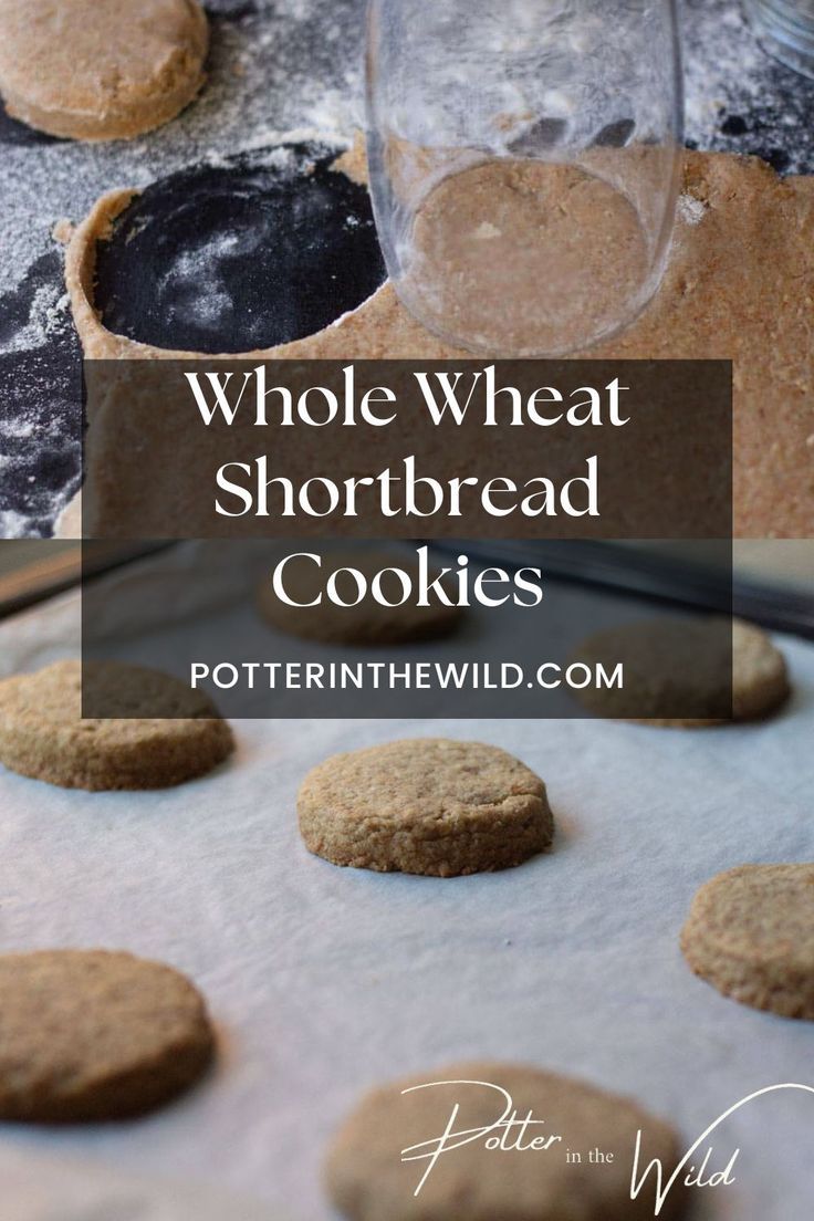 whole wheat shortbread cookies sitting on top of a cookie sheet with the words, whole wheat shortbread cookies