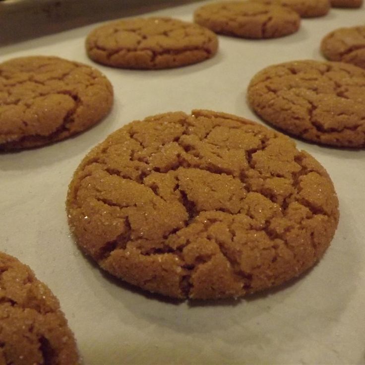 cookies are lined up on a baking sheet and ready to be baked in the oven