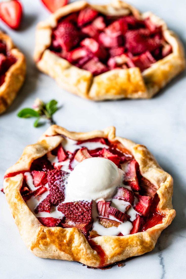 strawberry rhubarb galette with whipped cream on top