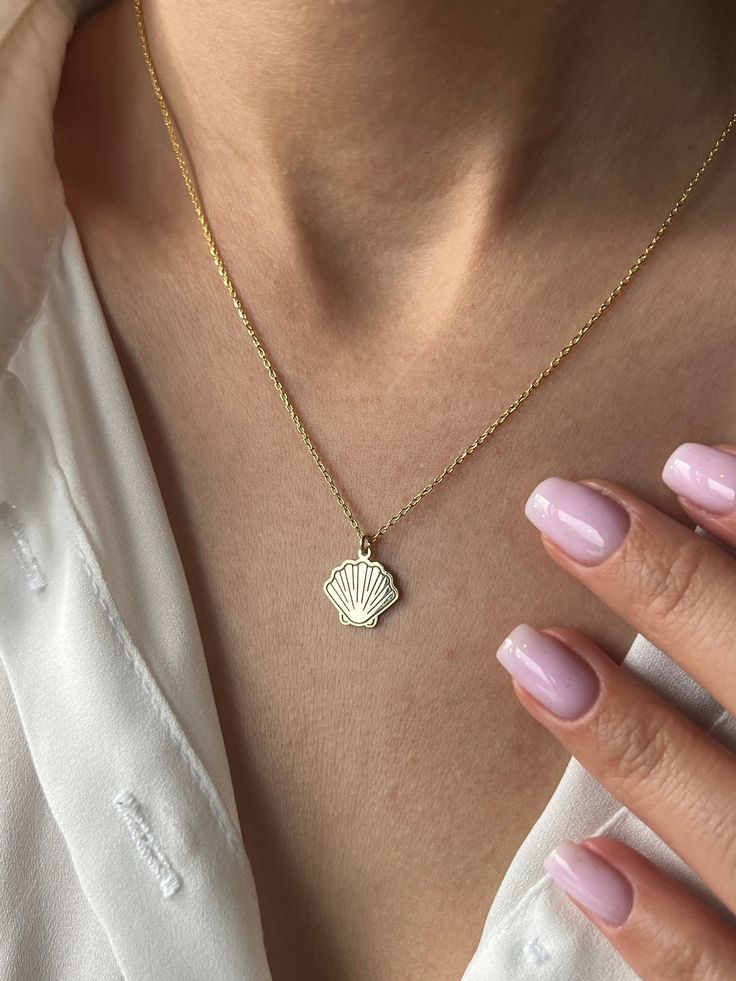 🦪Didn't we all accumulate a little bit when we were little?🦪 Choose from 925K Sterling Silver, adorned with a lavish array of finishes: Gold, Rose Gold, or White Gold, each radiating its own unique allure. A timeless treasure for all who adore beauty and sophistication 💛 Exquisite Details: * Crafted from 925K Sterling Silver, delicately plated with 14K Gold, Rose Gold, or White Gold * Select your preferred chain length: 18 inches (with a 2-inch extender) / 45 cm (with a 5 cm extender) or 22 i Gold Shell Ocean-inspired Necklace, Gold Shell-shaped Necklace For Beach, Yellow Gold Shell-shaped Necklace Gift, Gold Shell-shaped Necklace With Pearl Pendant, Adjustable Gold Shell-shaped Necklace, Oyster Necklace, Sea Shell Necklace, Sea Necklace, Beach Necklace