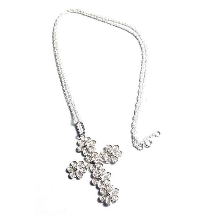 Delicate daisies in the form of a cross make up this intricate necklace. Designed by Giuliana Valz-Gen, the floral motifs are made by hand with threads of sterling silver in a style unique to Peru's filigree traditions. Sterling Silver 19.75 Inches Spring ring clasp Handmade in & fairly traded from Peru Paw Print Jewelry, Ribbon Jewelry, Printed Jewelry, A Cross, Floral Motifs, Toe Rings, Sterling Silver Necklace, Spring Rings, Floral Motif