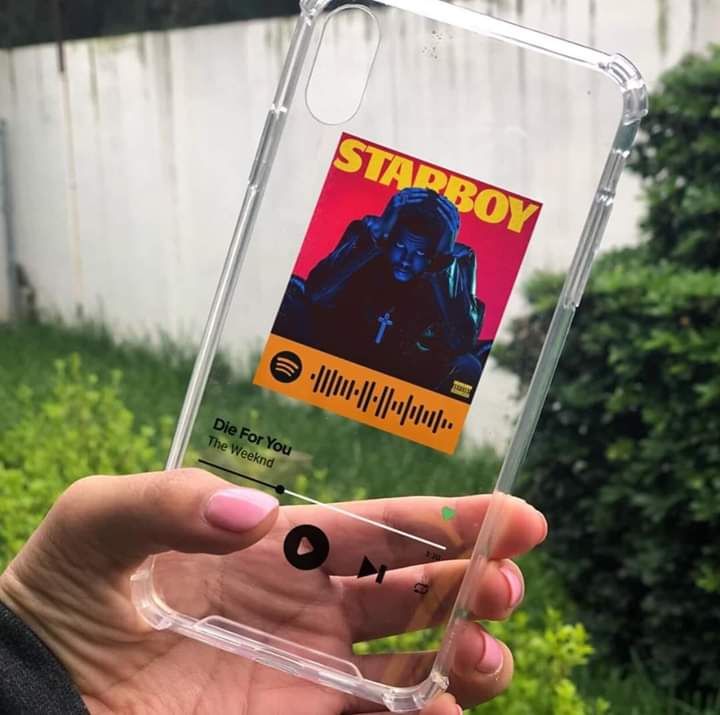 someone is holding up their phone case to take a photo with the starboy sticker on it