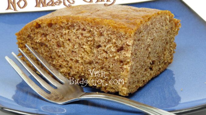 a piece of cake on a blue plate with a fork and no waste gingerbread sign in the background