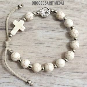 Adjustable Miraculous Medal For Gift, Adjustable Silver Beaded Cross Bracelets, Adjustable Silver Cross Beaded Bracelets, Adjustable Silver Beaded Bracelets With Cross Shape, Adjustable Silver Spiritual Jewelry And Charms, Adjustable Silver Rosary Bracelet With Miraculous Medal, Adjustable Spiritual Rosary, Adjustable Round Spiritual Rosary, White Miraculous Medal Spiritual Jewelry