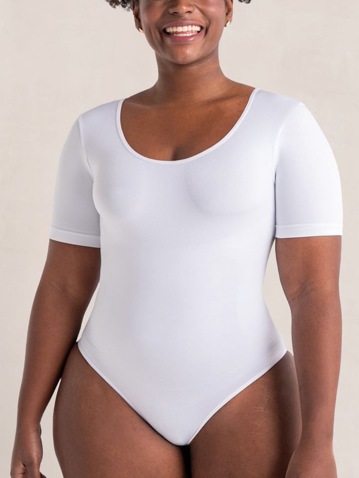 The perfect combination of comfort and style. This versatile bodysuit is designed to provide a seamless 360 tummy and back smoothing effect and flattering fit, with an opaque no-see-through fabric so you can wear it as a top. Whether you're dressing up for a special occasion or simply want to feel your best every day, this bodysuit is the ideal choice. With its short sleeves, our Seamless Short Sleeve Bodysuit offers light upper arm smoothing, giving you a confident and sleek look. It features a step-in design for easy on and off. No more struggling with getting in and out of your bodysuit – simply snap the 3-row adjustable gusset to your preferred fit, step in, and you're ready to go. Snap closure at crotch Extended gusset for easy to snap on and off 3 rows of snaps for adjustable length Female Antonamy, Reference Anime, Shaping Bodysuit, Women Body, Shapewear Bodysuit, Model Poses Photography, Body Drawing, Short Sleeve Bodysuit, Sleek Look