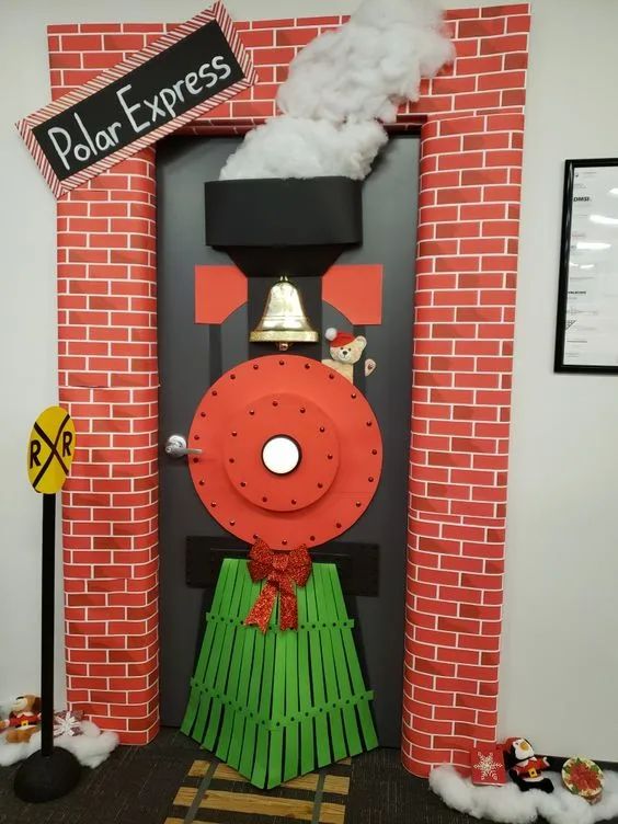 a fake train on display in front of a brick wall with a sign that says polar express