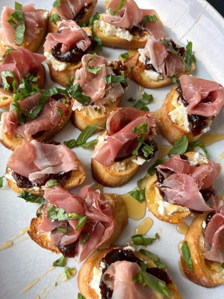 a white plate topped with bread covered in toppings