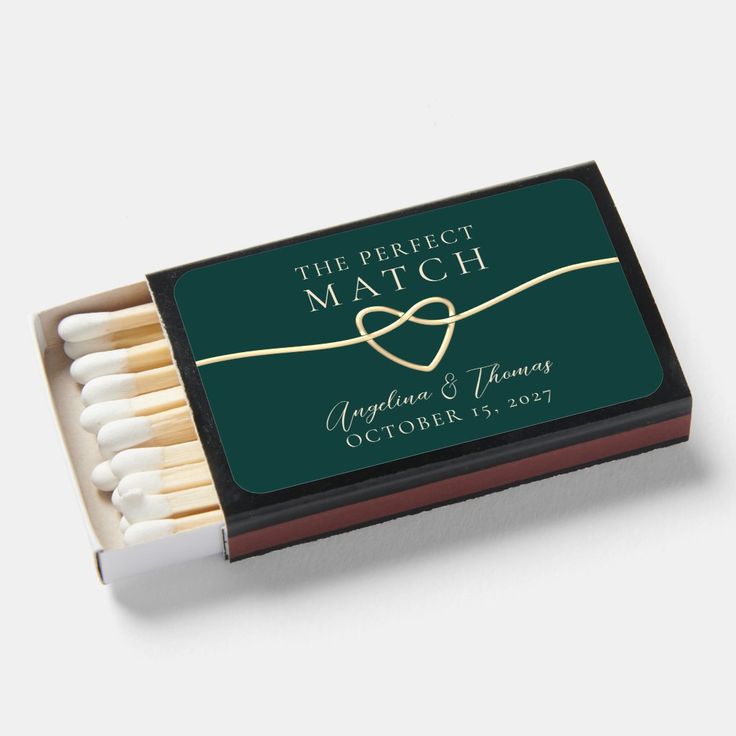 match box filled with matches on top of a white table