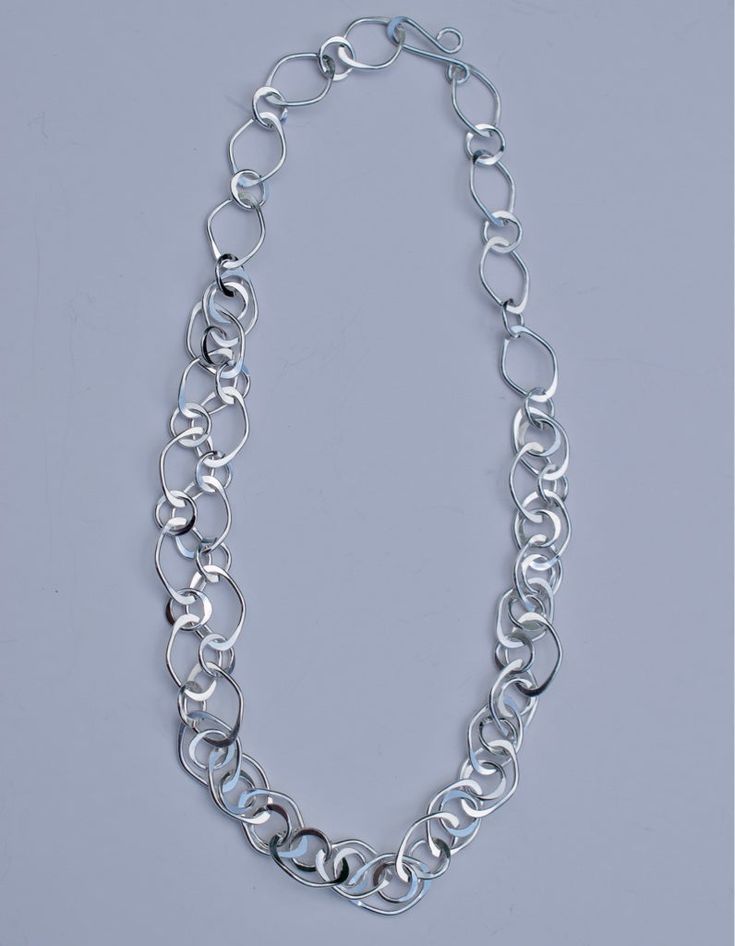 Handmade .925 sterling silver 18-inch necklace. The clasp design on this necklace allows the length to be adjusted. This necklace is sold individually, but can also be put together as part of a set with a matching bracelet, and a pair of earrings. Modern White Gold Chain Necklace With Sterling Silver Clasp, Silver Link Chain Necklace With Sterling Clasp, Minimalist Silver Necklace With Oval Link, Modern Silver Jewelry With Adjustable Chain, Minimalist Silver Oval Link Necklace, Sterling Silver Double Strand Adjustable Necklace, Adjustable Double Strand Sterling Silver Chain Necklace, Sterling Silver Link Necklace With Polished Finish, Modern Oval Link Chain Necklace With Sterling Silver Clasp