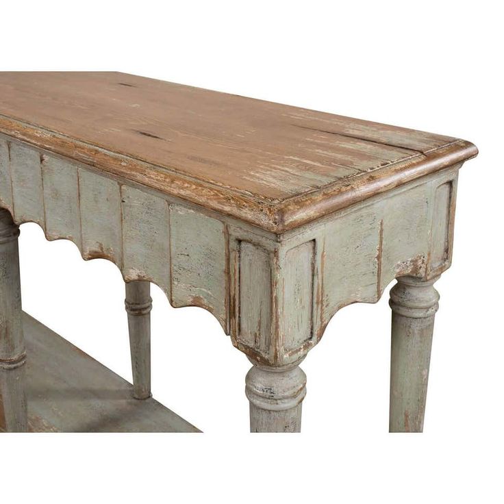 an old wooden table with two legs and a shelf on the bottom is painted white