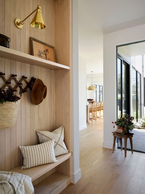 a room with wooden walls and shelves filled with items