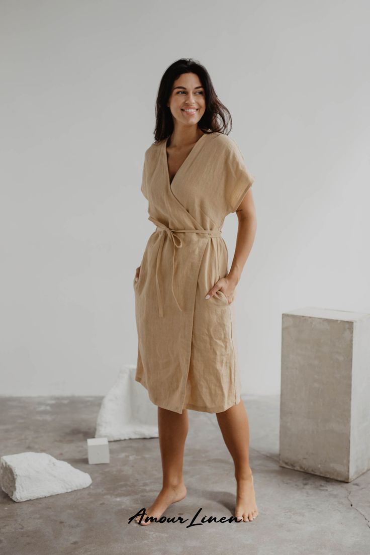 Linen wrap dress OLIVIA is perfect for a bohemian, casual chic, or feminine style. You can wear the dress as a party outfit, date night outfit, or even a wedding guest outfit. Perfect as spring outfit! This dress will complete a simple, minimalistic look. For chilly evenings choose our linen coat or jacket! Our eco-friendly and sustainable women's fashion is made from 100% European linen. Add our wrap dress to your capsule wardrobe today! Summer Wrap Dress With Surplice Neckline For Beach, Beige V-neck Wrap Dress For Summer, Summer Wrap Dress With Tie Waist For Vacation, Chic Wrap Dress With Tie Fastening For Summer, Chic Summer Wrap Dress With Tie Fastening, Belted Surplice Neckline Beach Dress, Summer Vacation Wrap Dress, Belted Beach Dress With Surplice Neckline, Summer Beach Wrap Dress With Tie Waist