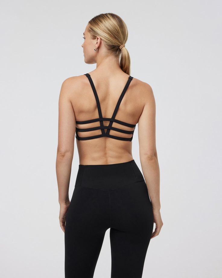 Classic medium-cut front with a strappy back, the Yosemite Sports Bra is up for adventure. Great for hiking, training and traveling. | Vuori Yosemite Bra | Black | XS Vuori makes premium performance apparel inspired by the active Coastal California lifestyle; an integration of fitness, surf, sport, and art. Breaking down the boundaries of traditional activewear, we are a new perspective on performance apparel. Training Activewear With Mesh And Strappy Back, Black Strappy Back Activewear For Yoga, Athleisure Activewear With Mesh And Strappy Back, Black Athleisure Sports Bra With Tank Straps, Sporty Strappy Sports Bra With Adjustable Straps, Athleisure Activewear With Mesh Strappy Back, Athleisure Black Sports Bra With Tank Straps, Black Compressive Activewear With Tank Straps, Sporty Strappy Mesh Back Sports Bra