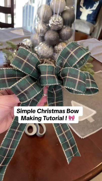 someone is making a bow on the table with christmas decorations in the background and text that reads, simple christmas bow making tutorial