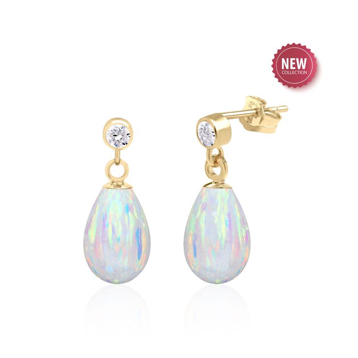 Sure to make heads turn, these opal earrings feature 12x8 mm Kyocera created white opal teardrops  dangling from white topaz accented stud earrings. Drop length is 0.7 inches. Available in 14K Gold Filled and Sterling Silver. An enchanting play of colors coupled with the opulence of gold. Subtle sparkle - perfect for everyday and occasion wear. The perfect wedding jewelry for a bride who prefers something simple yet stunning for her big day. Surprise mom, wife or mother in law with a Mothers Day Opal Earrings For Anniversary - Fine Jewelry, Opal Gemstone Earrings For Anniversary, Fine Jewelry Opal Earrings For Anniversary, White Opal Jewelry With Matching Earrings, Opal Jewelry In Yellow Gold With Matching Earrings, Yellow Gold Opal Jewelry With Matching Earrings, Anniversary Opal Earrings Fine Jewelry, Pear-shaped Opal Jewelry For Formal Occasions, Formal Opal Pear-shaped Jewelry