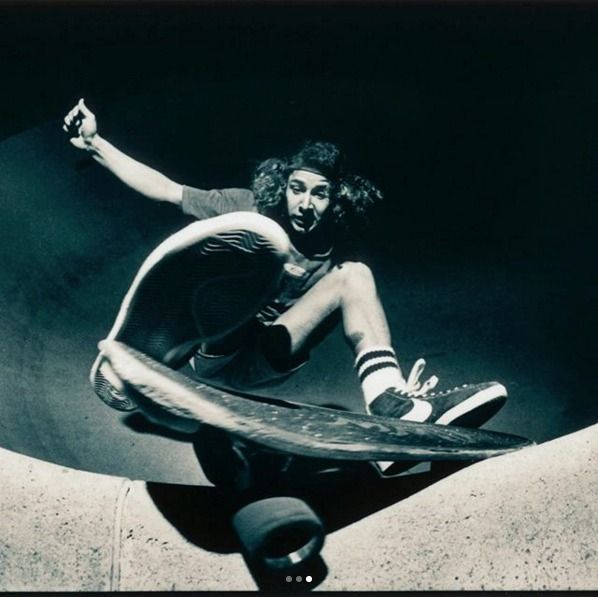 a man riding a skateboard up the side of a ramp