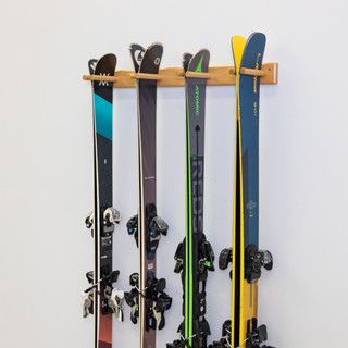 there are many skis hanging on the wall