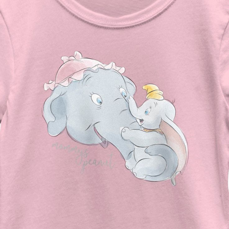 Spread your ears and soar away with Dumbo and this officially licensed Disney Dumbo Mrs. Jumbo Mommy's Peanut Graphic T-Shirt! This adorable tee features a beautiful watercolor style graphic of Mrs. Jumbo holding her son Dumbo printed across the front, along with the phrase: "Mommy's Peanut" in silver script lettering below. Give your mom the best Mother's Day ever with this new Dumbo apparel and enjoy an elephant-astic Disney style that is perfect for your Disney-loving mom! Disney Fan Merchandise Top, Pre-shrunk, Pink Cartoon Print T-shirt For Disney Trips, Pink Disney T-shirt For Disney Trips, Peanuts T Shirts, Script Lettering, Beautiful Watercolor, Disney Style, Girls Shopping, Peanut