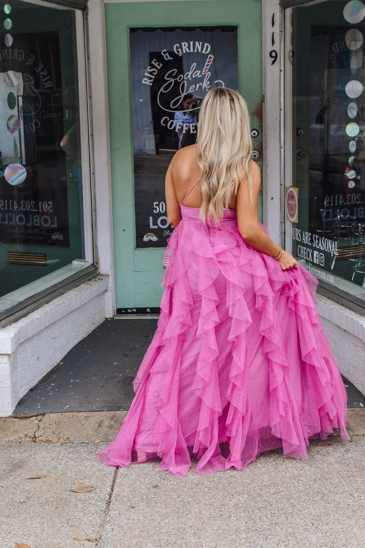 Get ready to dazzle in our Dangerously Perfect Pink Ruffle Dress! This elegant and formal dress features a sparkly fabric that will definitely make you stand out in any crowd. Perfect for a special occasion or a night out, this dress is dangerously perfect in pink! Chic Ruffled Dresses For Homecoming, Chic Homecoming Dress With Ruffles, Pink Maxi Dress For Prom Season, Glamorous Maxi Length Evening Dress For Homecoming, Glamorous Maxi Evening Dress For Homecoming, Glamorous Maxi Length Homecoming Evening Dress, Pink Ruffled Skirt Prom Dress, Pink Prom Dress With Ruffled Skirt, Pink Tulle Dresses For Prom Season