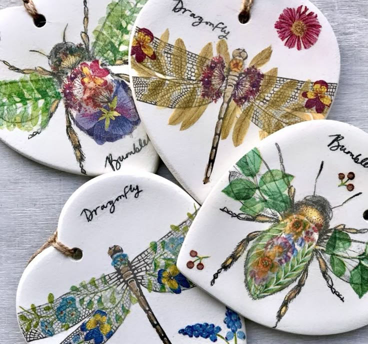 four ceramic dragonflys with names on them