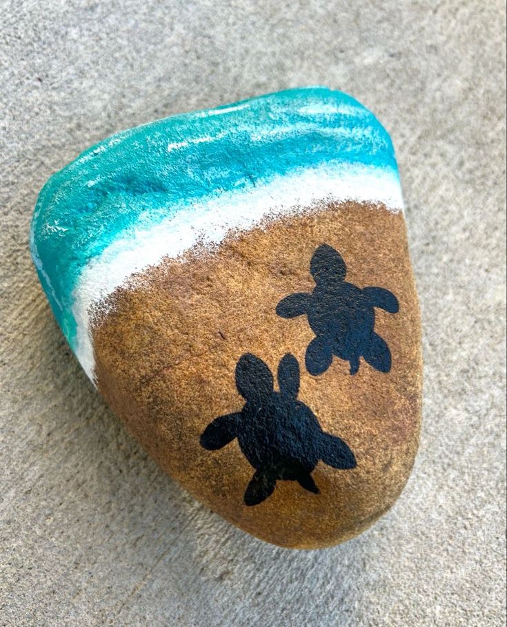 a painted rock with a turtle on it