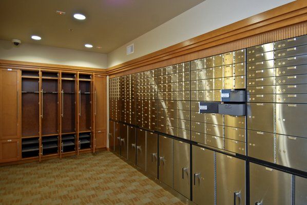 the lockers are lined up against the wall in the room with many doors and drawers