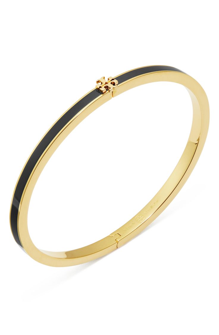 Add Tory's signature sophistication to your wrist stack with an enameled hinge bracelet clasped with iconic double-T logo hardware. 6 1/2" inner circumference; 1/8" width 18k-gold plate/enamel Imported Elegant Black Jewelry With Gold-tone Hardware, Classic Black Enamel Bangle Bracelet, Classic Black Enamel Bangle Jewelry, Classic Black Enamel Bangle, Wrist Stack, Hinge Bracelet, Wrist Stacks, Tory Burch Kira, Hinged Bracelet