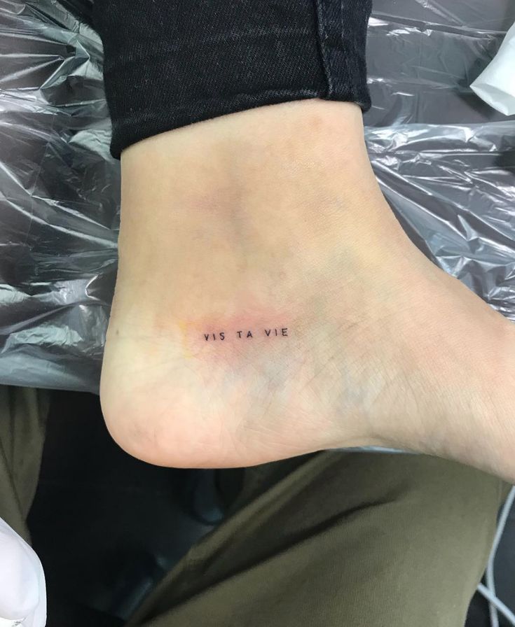 a person with a small tattoo on their foot