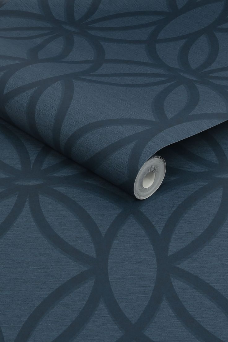 a dark blue wallpaper with an intricate design on the back and side of it