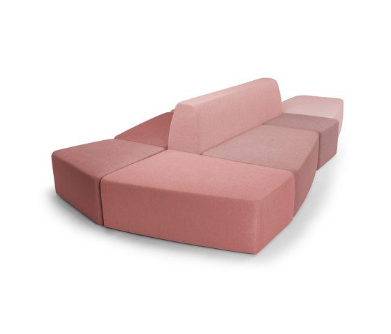 a pink couch sitting on top of a white floor