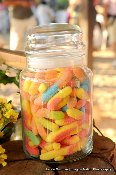 a glass jar filled with lots of colorful candy