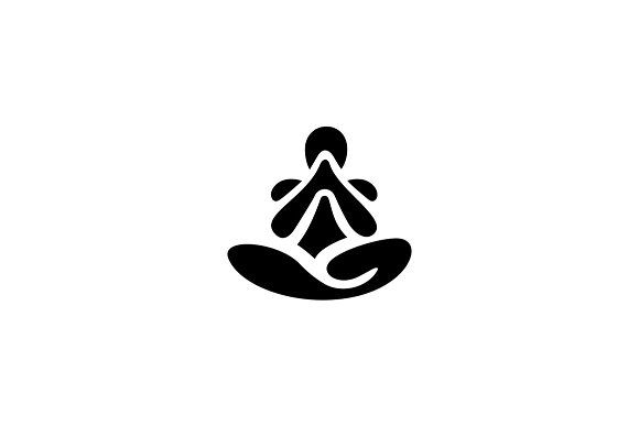 a black and white image of a person sitting in the middle of a lotus pose