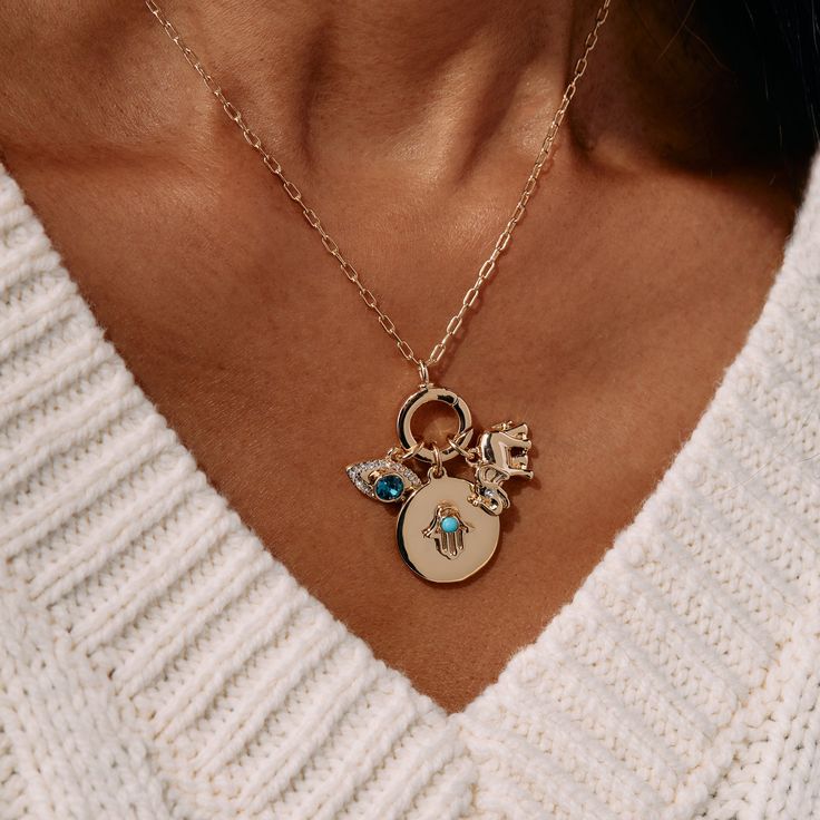 Wear symbols of protection and positivity as you navigate your personal journey. This Protection Mix + Match Charm Necklace Gift Set features three powerful protective symbols: a turquoise and clear glass crystal stone evil eye charm, a circular charm with a turquoise glass crystal-embellished hamsa hand, and an elephant charm on an adjustable 16”-18” chain. A new, interchangeable necklace design lets you make the look all your own: swap out the charms or add more symbols to make a charm necklac Evil Eye Pendant Charm Necklace For Everyday, Everyday Evil Eye Pendant Charm Necklace, Evil Eye Pendant Charm Necklace, Spiritual Turquoise Charms Necklaces, Turquoise Jewelry With Moon Charm For Gift, Evil Eye Amulet Jewelry For Healing, Healing Amulet Jewelry With Evil Eye, Healing Evil Eye Amulet Jewelry, Personalized Round Turquoise Jewelry