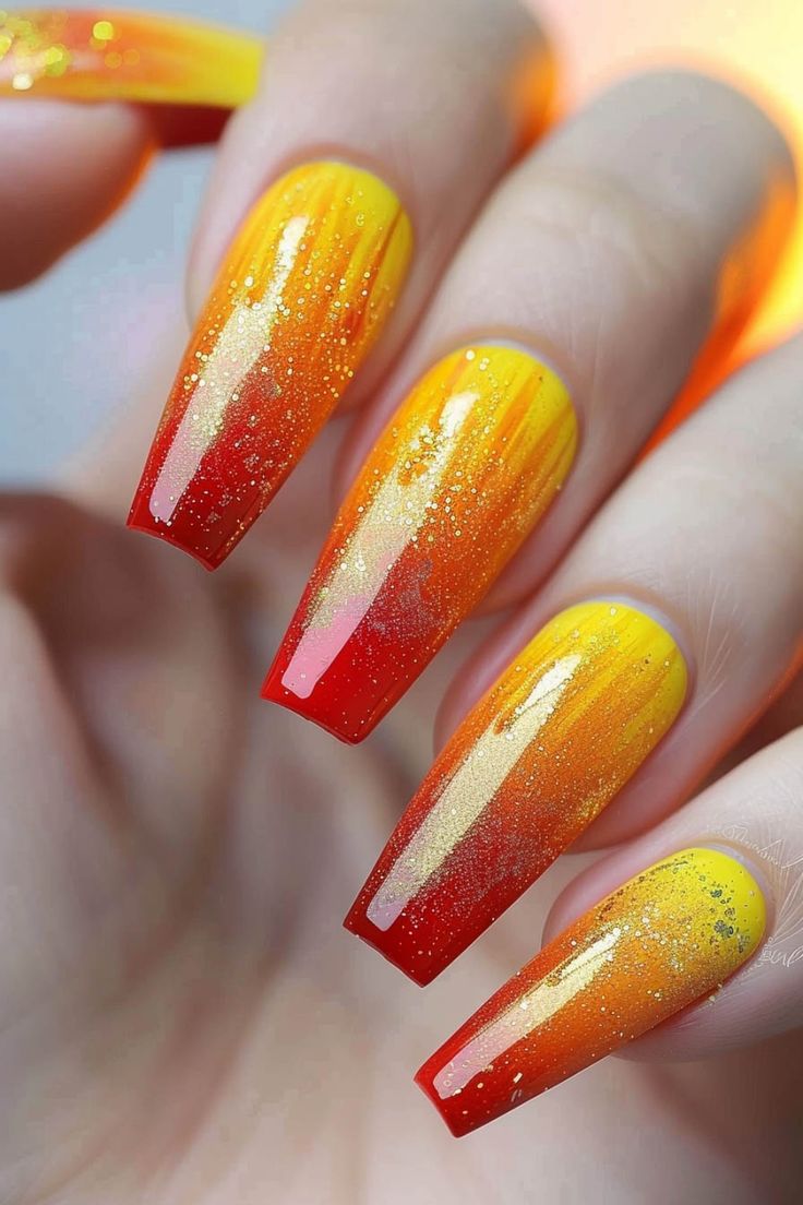 Long nails with a gradient of yellow to red colors and sparkly accents resembling a sunset. Vibrant Summer Nails, Edgy Nail Art, Summer Nail Ideas, Marble Nail Designs, Festive Nail Art, Bright Summer Nails, Square Nail Designs, Edgy Nails, Cute Patterns