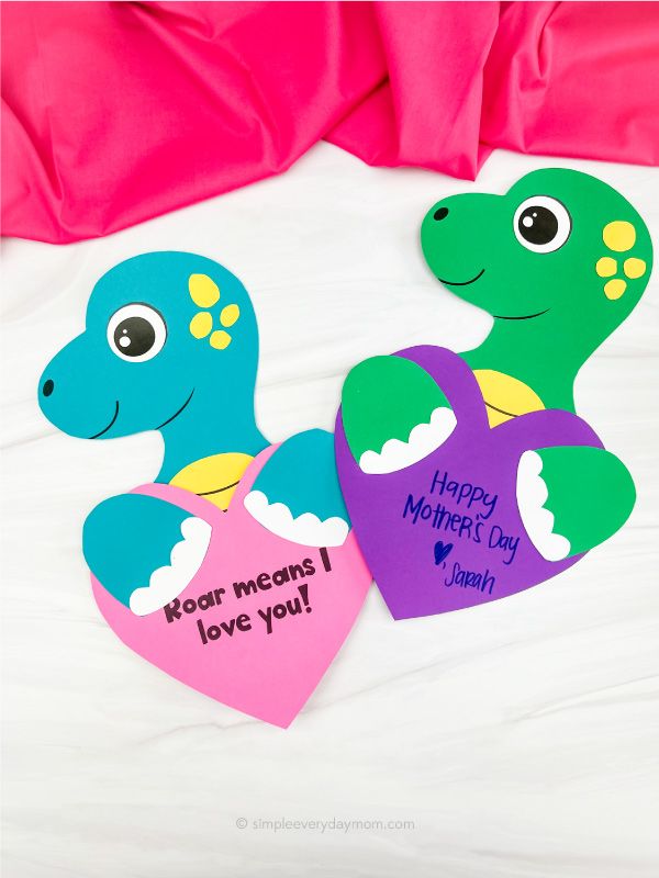 two heart shaped paper cutouts with the words happy mothers day and i love you written on them