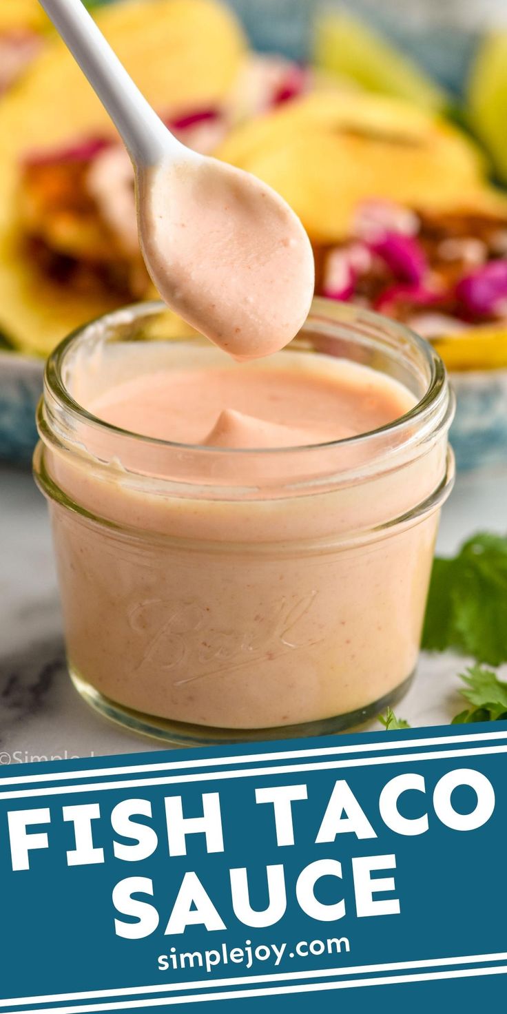 fish taco sauce in a small glass jar with a spoon sticking out of it